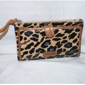 Consuela blue jag wallet that is in used condition.